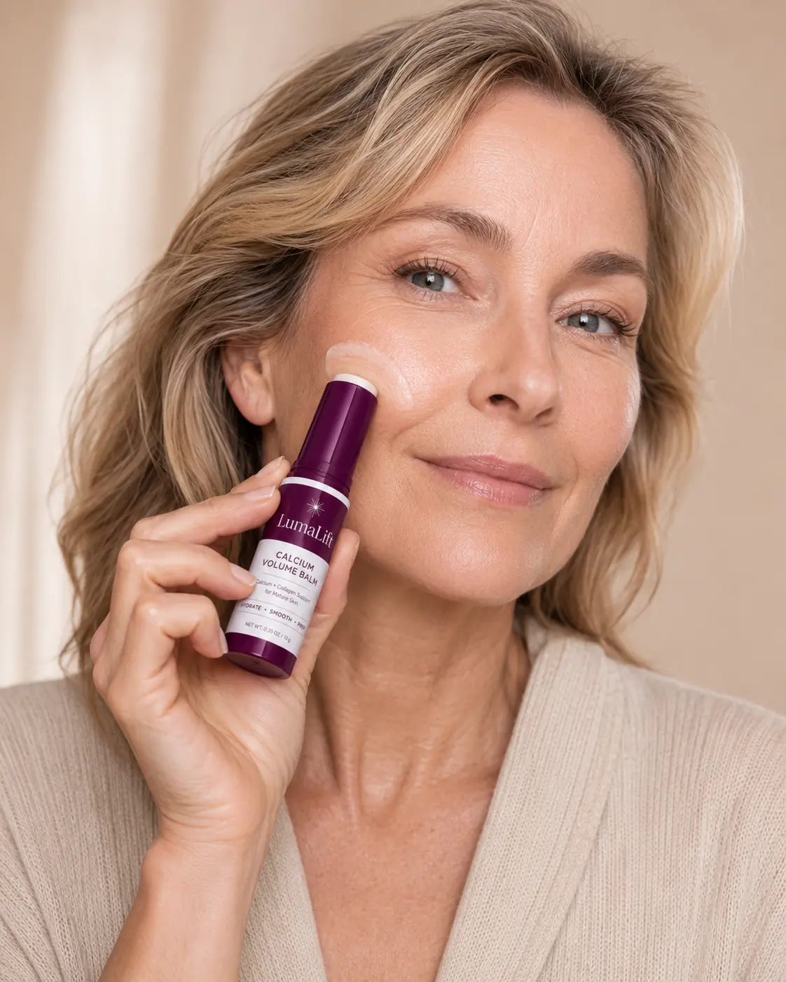 Applying LumaLift balm and tapping it into the skin